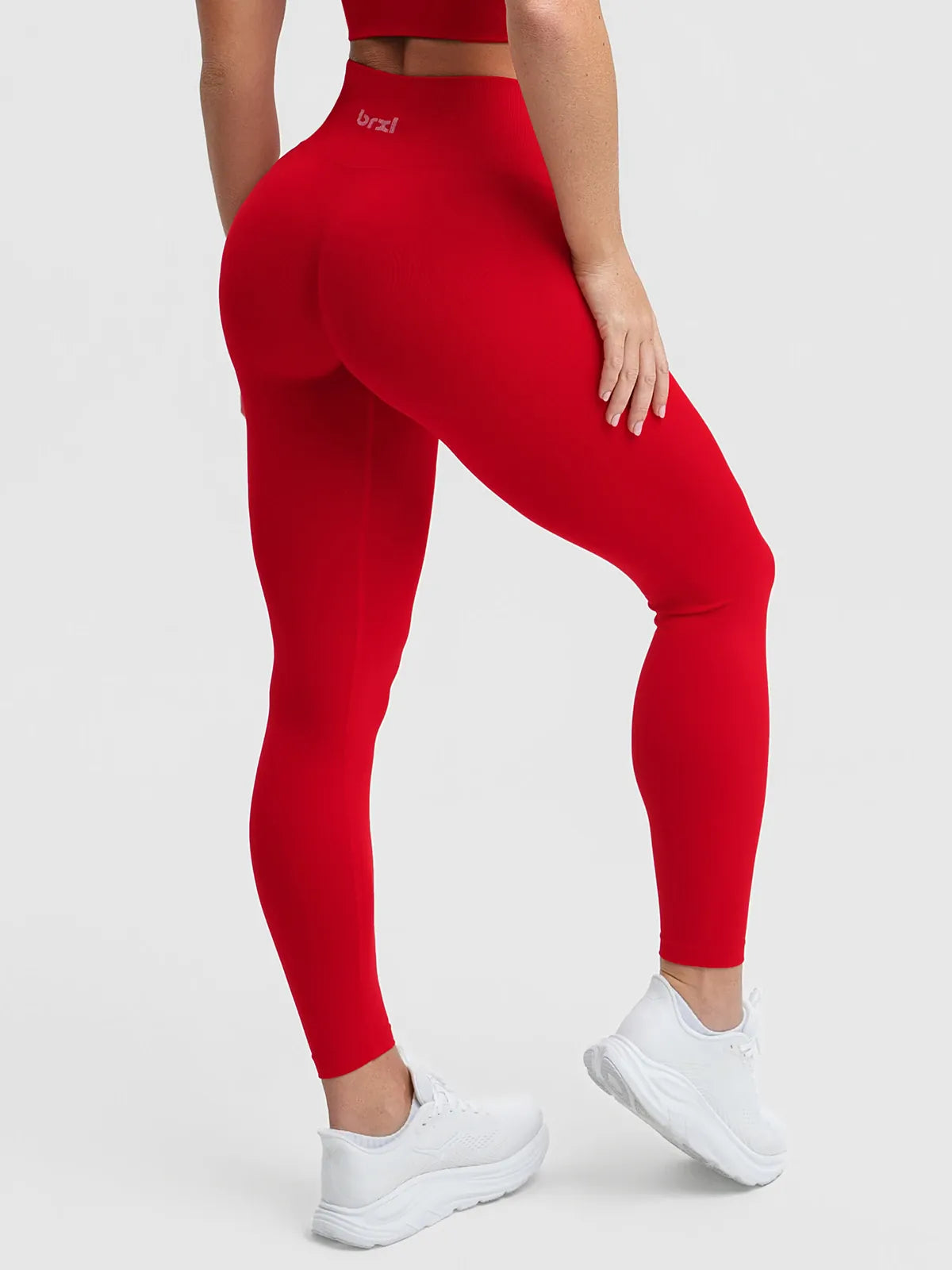A model wearing a BRXL® STAYLAT™ Seamless High-Rise Sculpt Anti-Roll Leggings 3.0