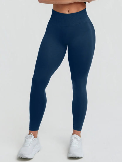 A model wearing a BRXL® STAYLAT™ Seamless High-Rise Sculpt Anti-Roll Leggings 3.0 Charcoal Blue / XS