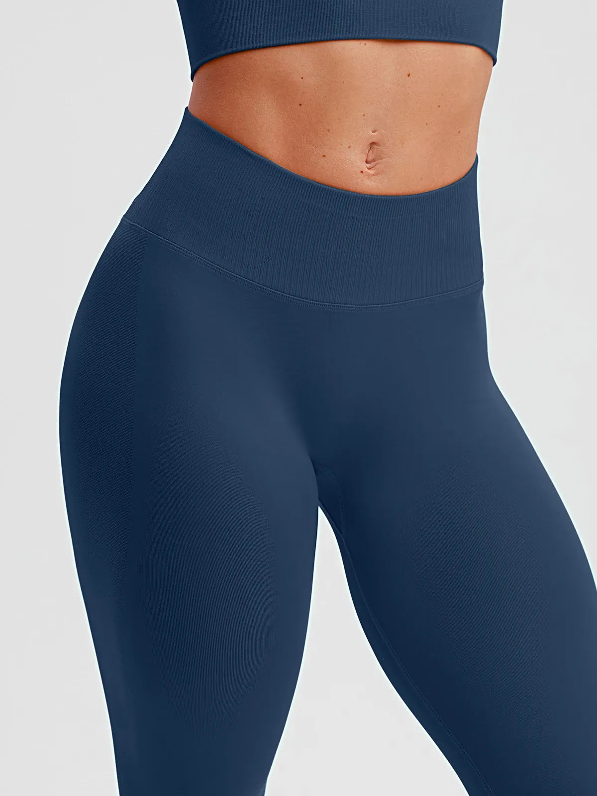 A model wearing a BRXL® STAYLAT™ Seamless High-Rise Sculpt Anti-Roll Leggings 3.0