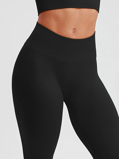 A model wearing a BRXL® STAYLAT™ Seamless High-Rise Sculpt Anti-Roll Leggings 3.0