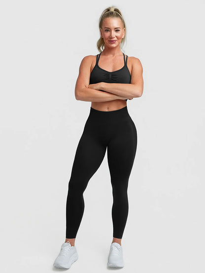 A model wearing a BRXL® STAYLAT™ Seamless High-Rise Sculpt Anti-Roll Leggings 3.0