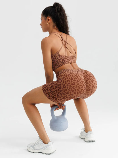 A model wearing a BRXL® B R X L™ Seamless Criss Cross Spaghetti Racerback Sports Bra