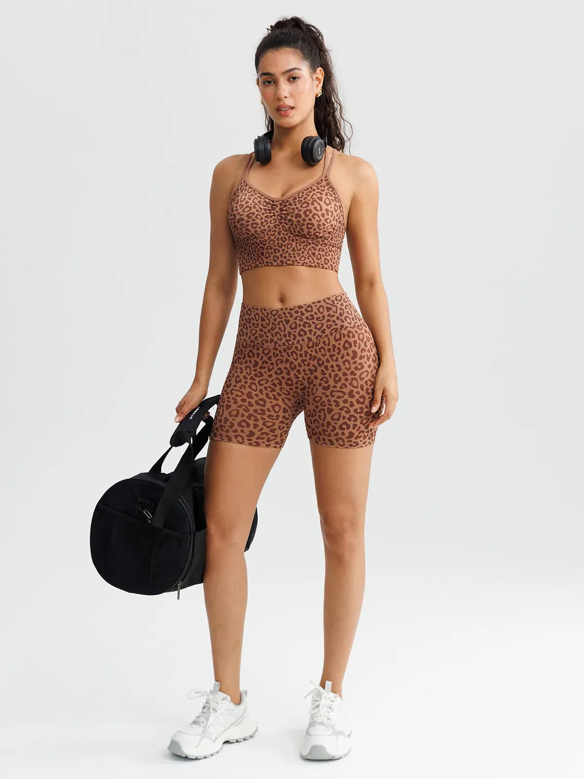 A model wearing a BRXL® B R X L™ Seamless Criss Cross Spaghetti Racerback Sports Bra