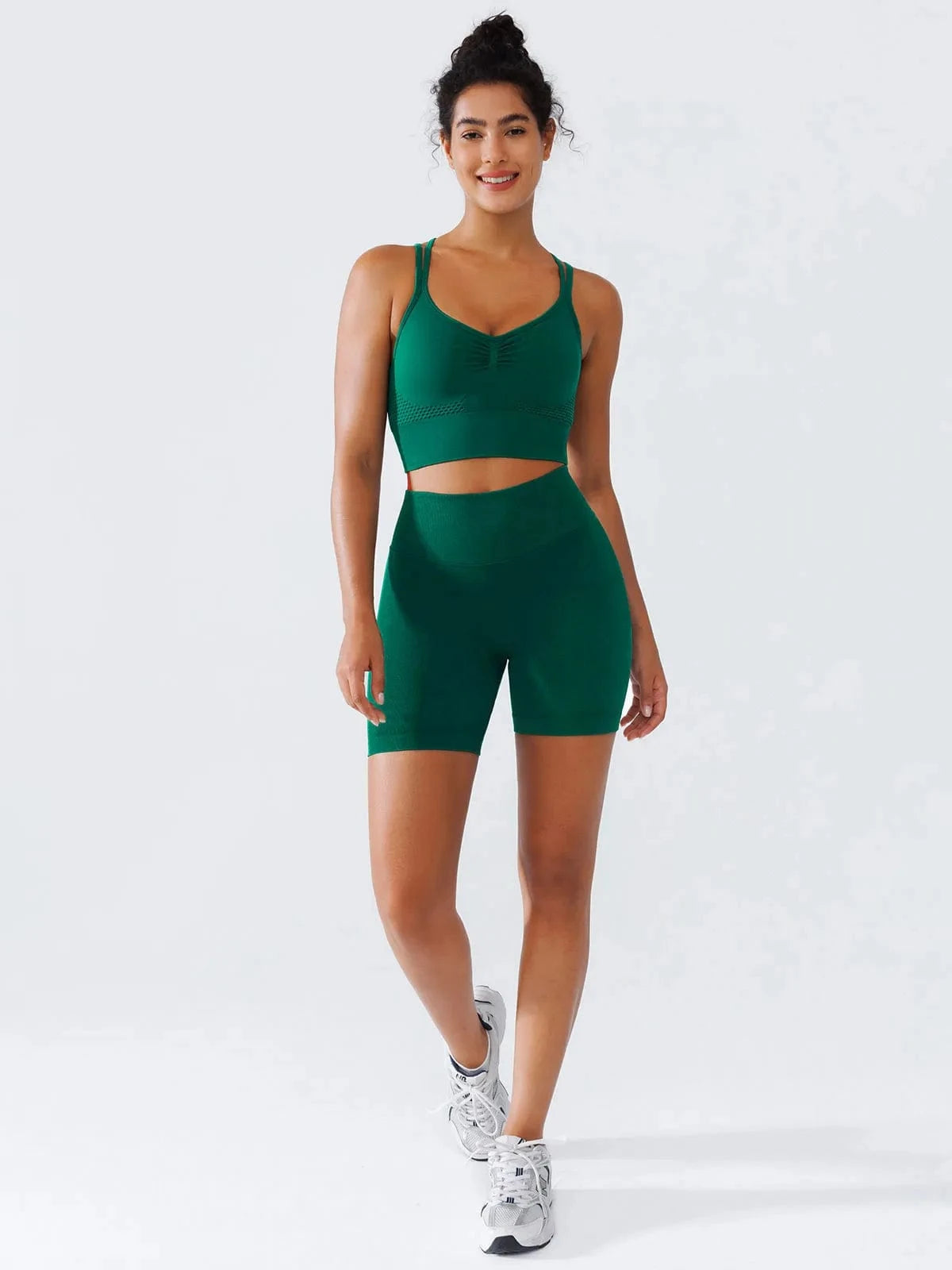 A model wearing a BRXL® Seamless Criss Cross Spaghetti Racerback Sports Bra