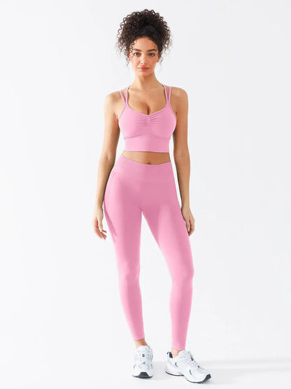 A model wearing a BRXL® B R X L™ Seamless Criss Cross Spaghetti Racerback Sports Bra
