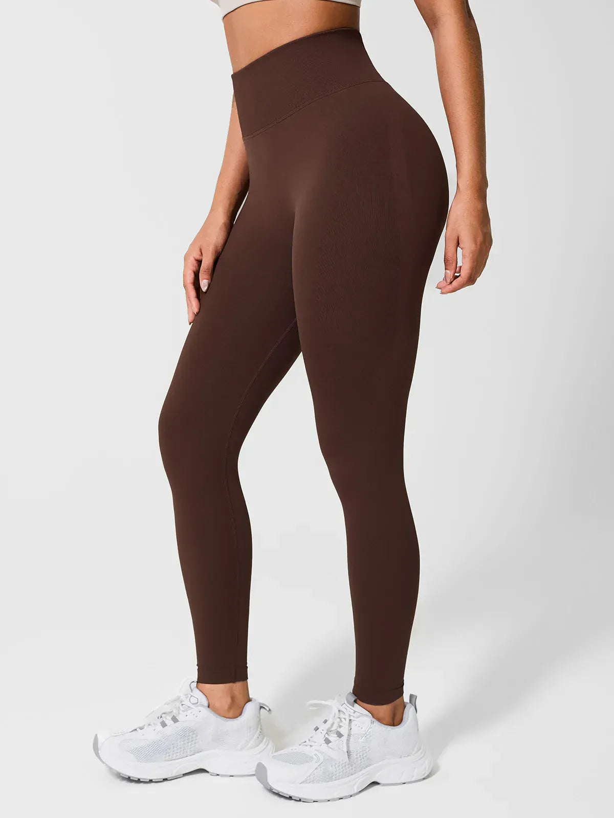 A model wearing a BRXL® Seamless High Waisted Butt-Lifting Leggings in