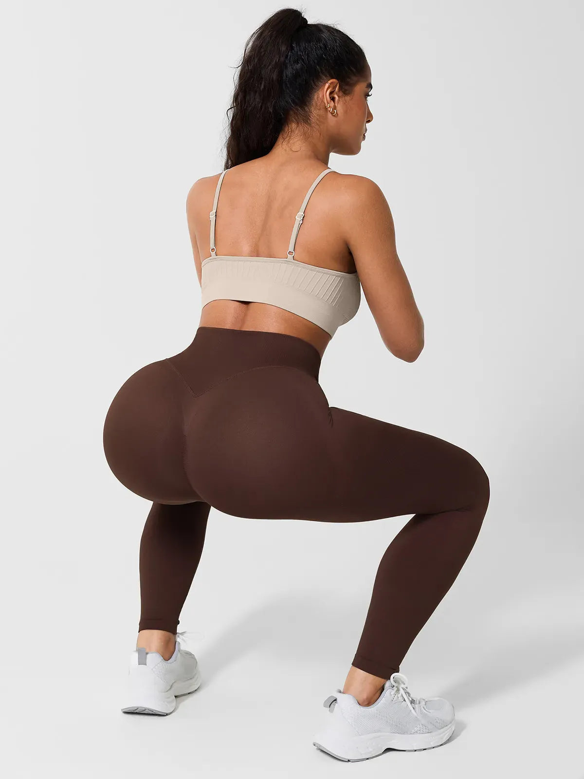 A model wearing a BRXL® Seamless High Waisted Butt-Lifting Leggings in