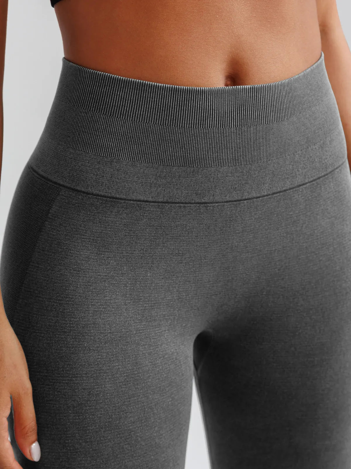 A model wearing a BRXL® B R X L™ Seamless High Waisted Butt-Lifting Leggings