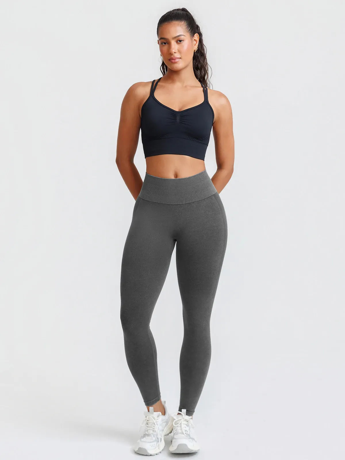 A model wearing a BRXL® B R X L™ Seamless High Waisted Butt-Lifting Leggings